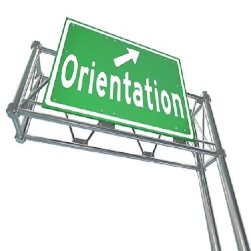 The word Orientation on a green freeway direction sign to point the way for new students or employees